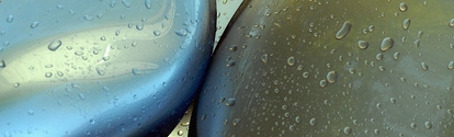 Waterdrops on car shapes coated with a paint that gleams like liquid metal