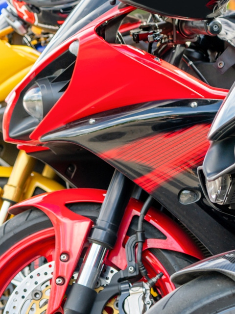 Motorcycles group parking on city street during adventure journey