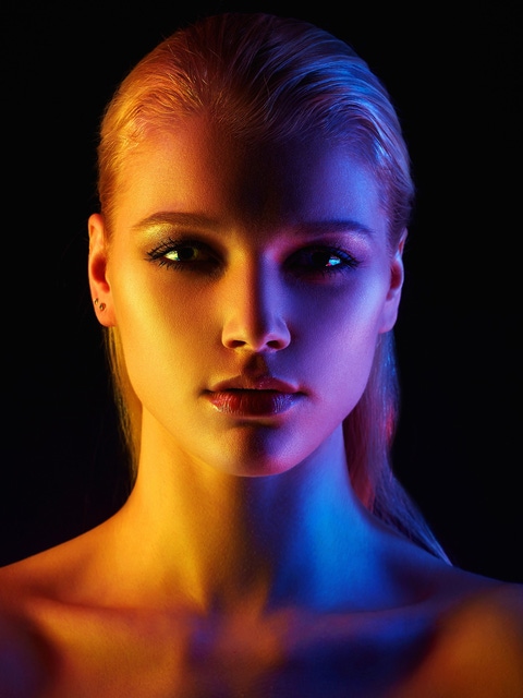 Face of a woman in different lights