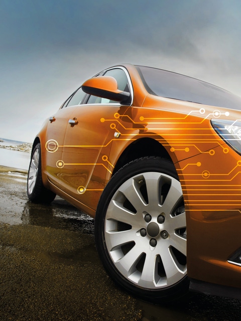 Orange car model with digital visuals 